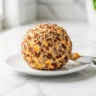 Delicious homemade cheddar ranch cheese ball coated in pecans